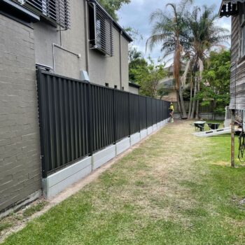 CONCRETE WALL WITH MONUMENT COLORBOND ON TOP NUNDAH