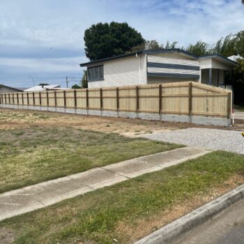 CONCRETE SLEEPER WALL WITH TIMBER ON TOP, DEAGON