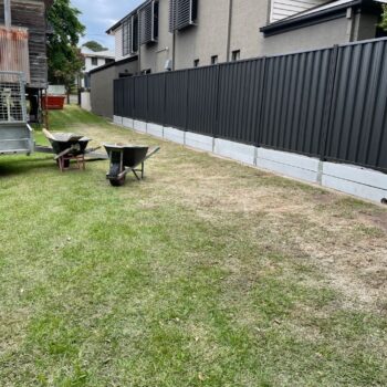 CONCRETE WALL WITH MONUMENT COLORBOND ON TOP NUNDAH