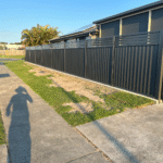 Monument Colorbond fencing with aluminium slat infill on top
