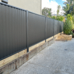 Metzag colorbond fencing with 200 x 50 pine sleeper