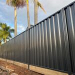 Supply and installed Metline colorbond fence with 200 x 50 treated pine sleeper Northside Fencing
