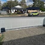 Vertical slat sliding gate