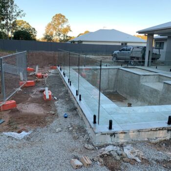 FRAMELESS GLASS FENCING BLACK SPIGOTS