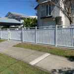 White hamptons style alum slat fencing