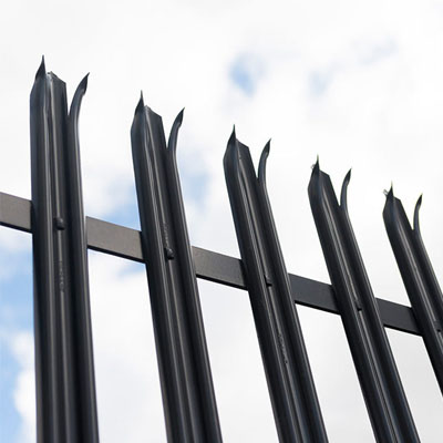 Palisade fencing aligned consistently along industrial property boundary