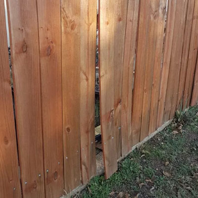 Timber-Look Fencing Without the Ongoing Timber Upkeep - Warped timber fence