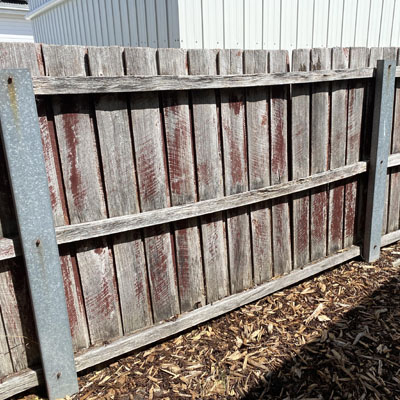 Timber-Look Fencing Without the Ongoing Timber Upkeep - Weathered timber fence